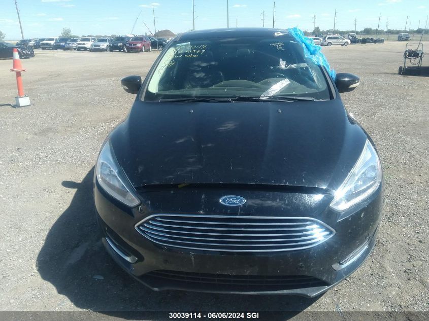 2016 Ford Focus Titanium VIN: 1FADP3J28GL277993 Lot: 30039114