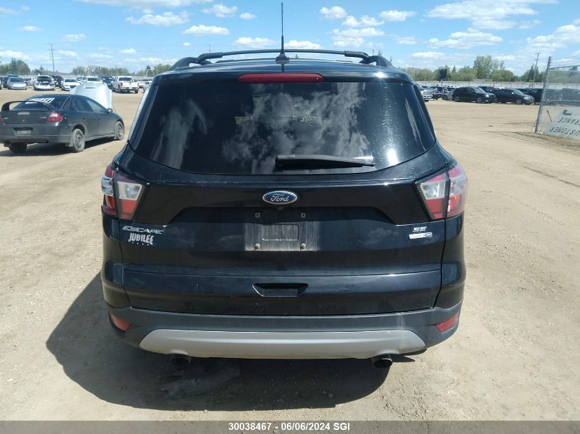 2018 Ford Escape Se VIN: 1FMCU9GD7JUB57299 Lot: 30038467