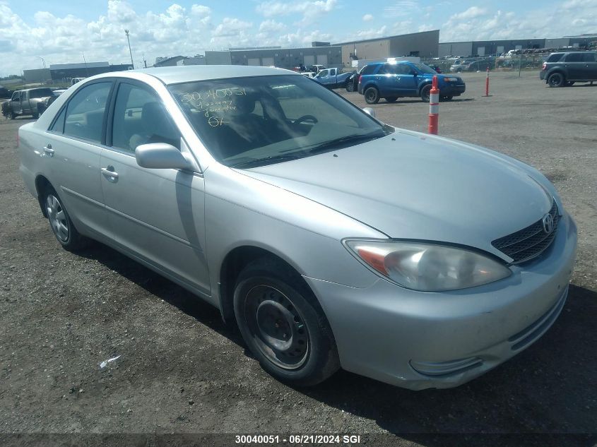 2003 Toyota Camry Le/Xle VIN: JTDBE32KX30223497 Lot: 30040051