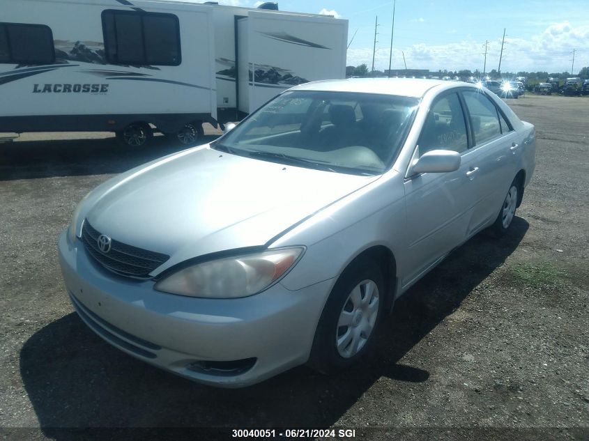 2003 Toyota Camry Le/Xle VIN: JTDBE32KX30223497 Lot: 30040051