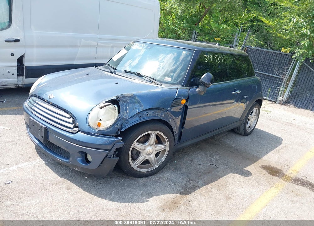 2009 MINI COOPER VIN: WMWMF335X9TU73566