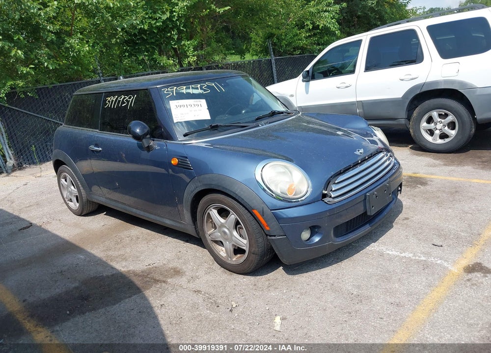 2009 MINI COOPER VIN: WMWMF335X9TU73566