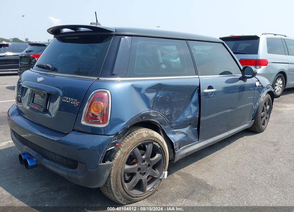 2009 MINI COOPER S VIN: WMWMF73559TT99013
