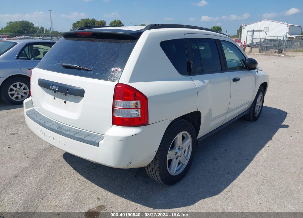 2009 JEEP COMPASS VIN: 1J4FT47B69D102693