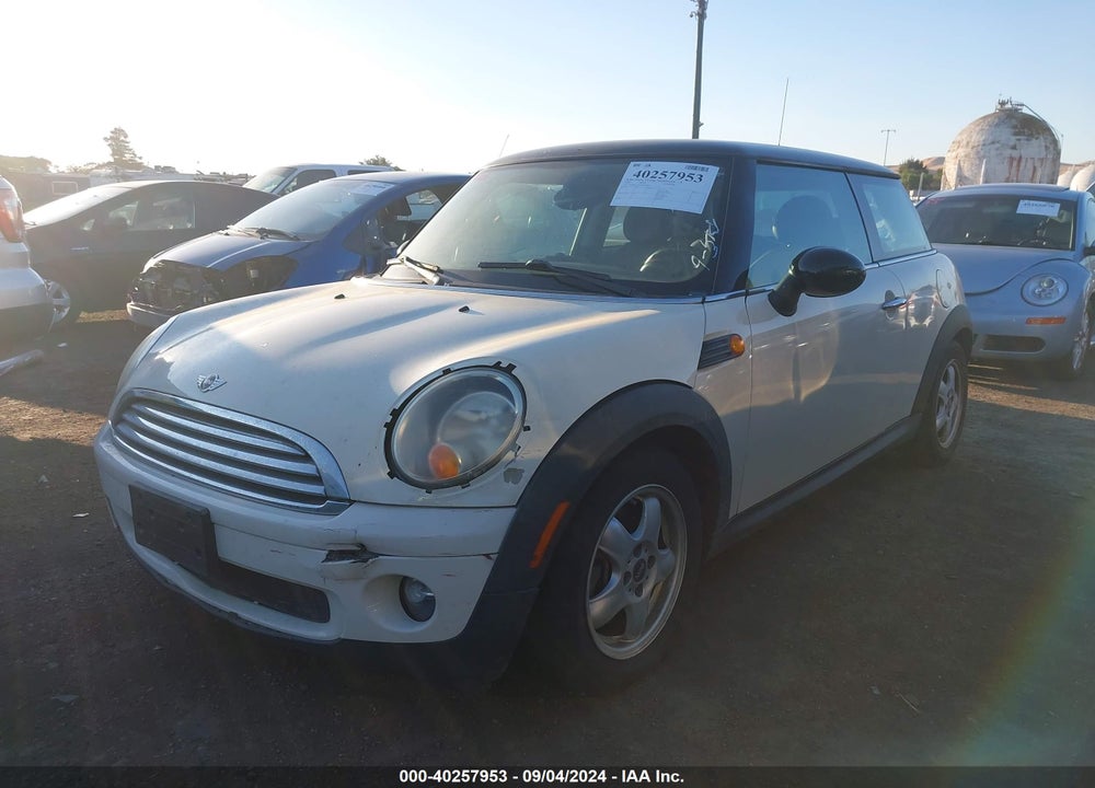 2009 MINI COOPER VIN: WMWMF335X9TW72066