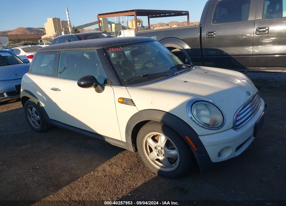 2009 MINI COOPER VIN: WMWMF335X9TW72066