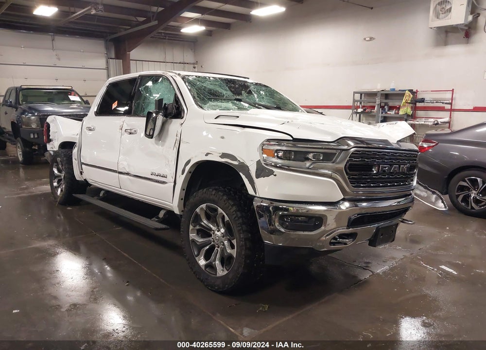 2019 RAM 1500 LIMITED 4X4 5'7 BOX VIN: 1C6SRFHT2KN709574