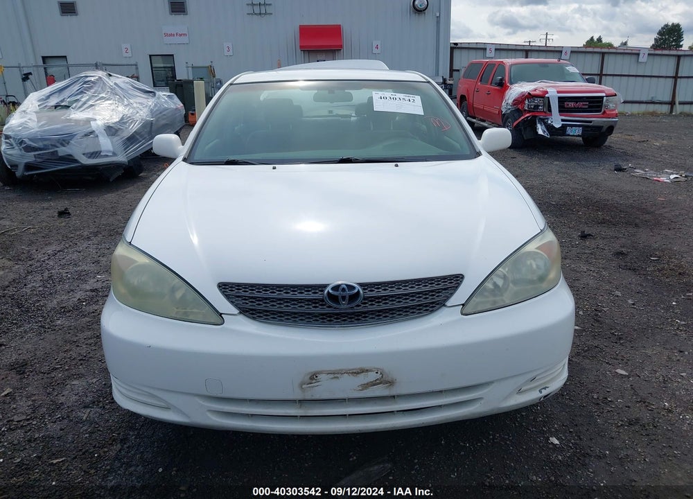 2004 TOYOTA CAMRY LE VIN: JTDBE32K940279111