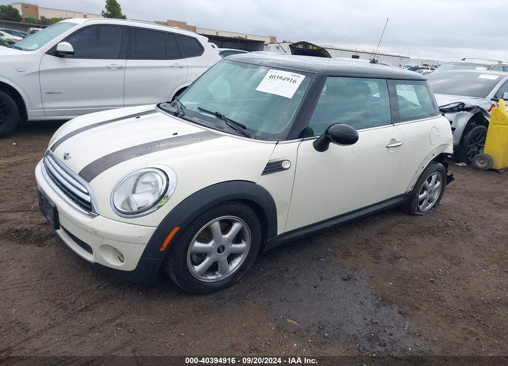 2009 MINI COOPER VIN: WMWMF33569TW71027