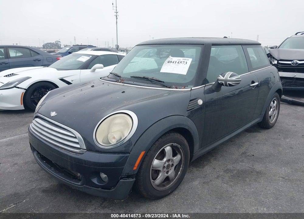 2009 MINI COOPER VIN: WMWMF335X9TU70229