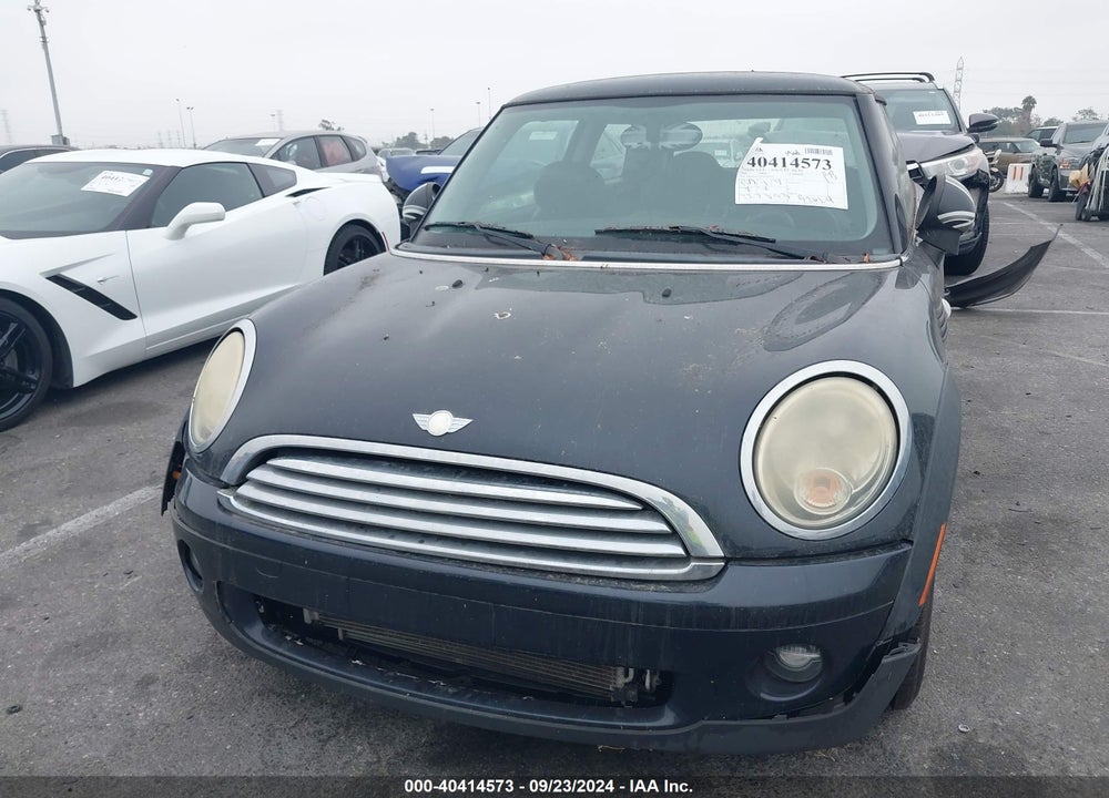 2009 MINI COOPER VIN: WMWMF335X9TU70229
