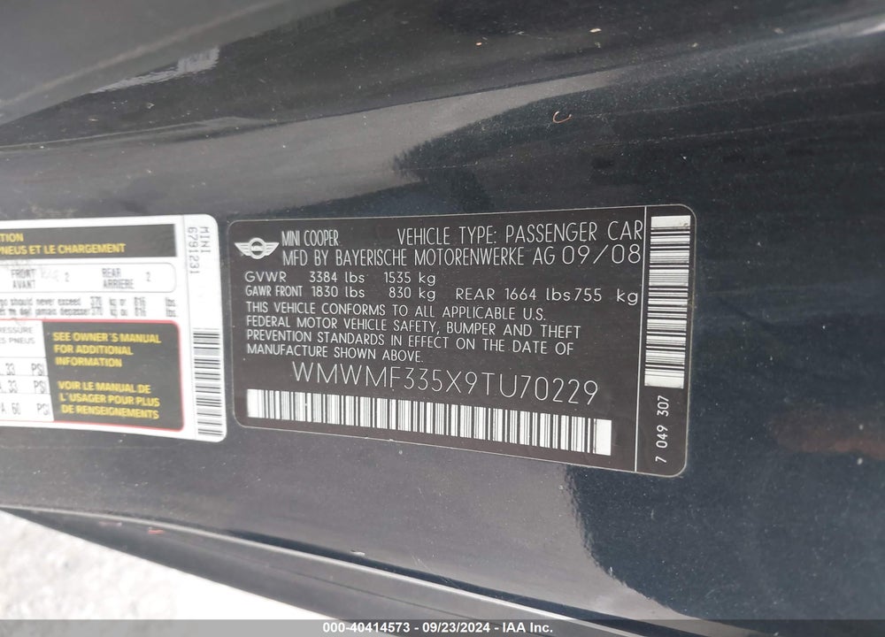 2009 MINI COOPER VIN: WMWMF335X9TU70229