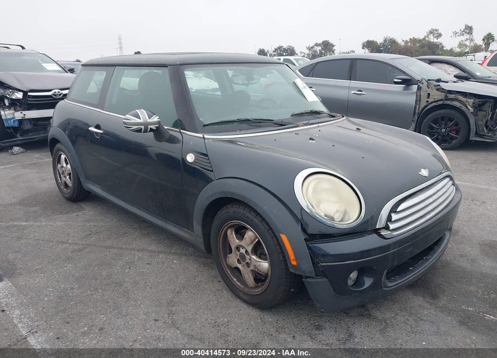 2009 MINI COOPER VIN: WMWMF335X9TU70229