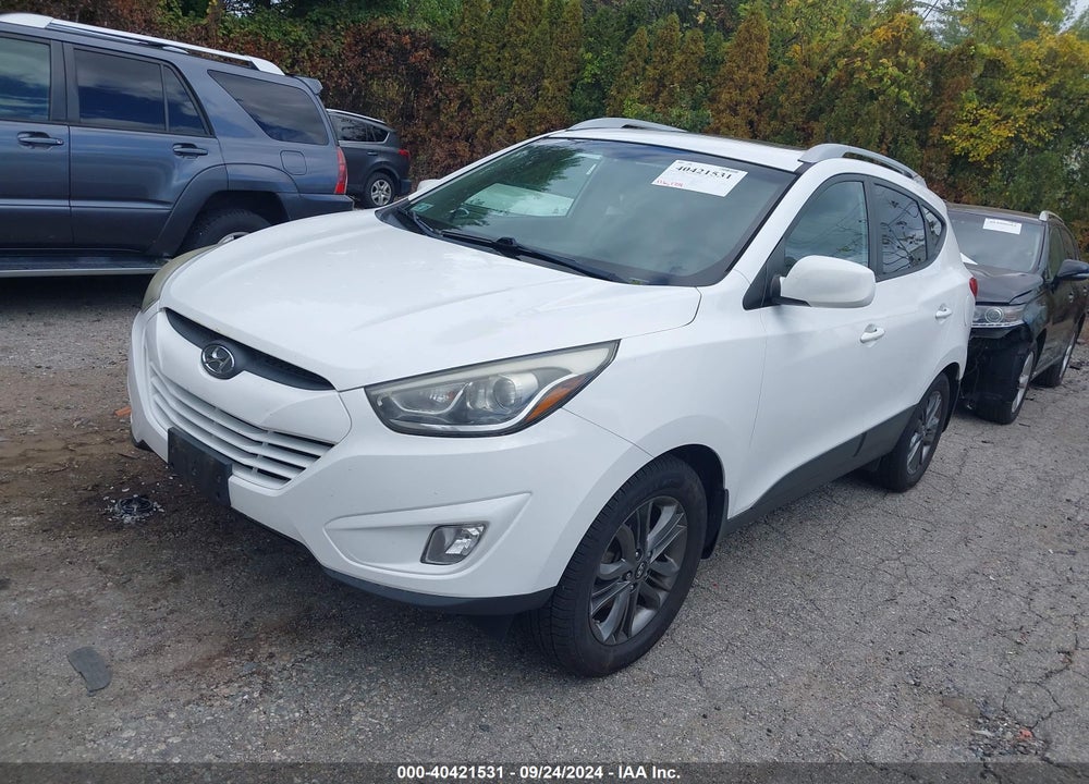 2014 HYUNDAI TUCSON SE VIN: KM8JUCAG2EU864095