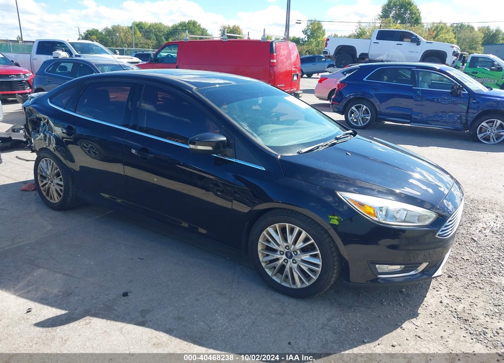 2016 FORD FOCUS TITANIUM VIN: 1FADP3J20GL243689