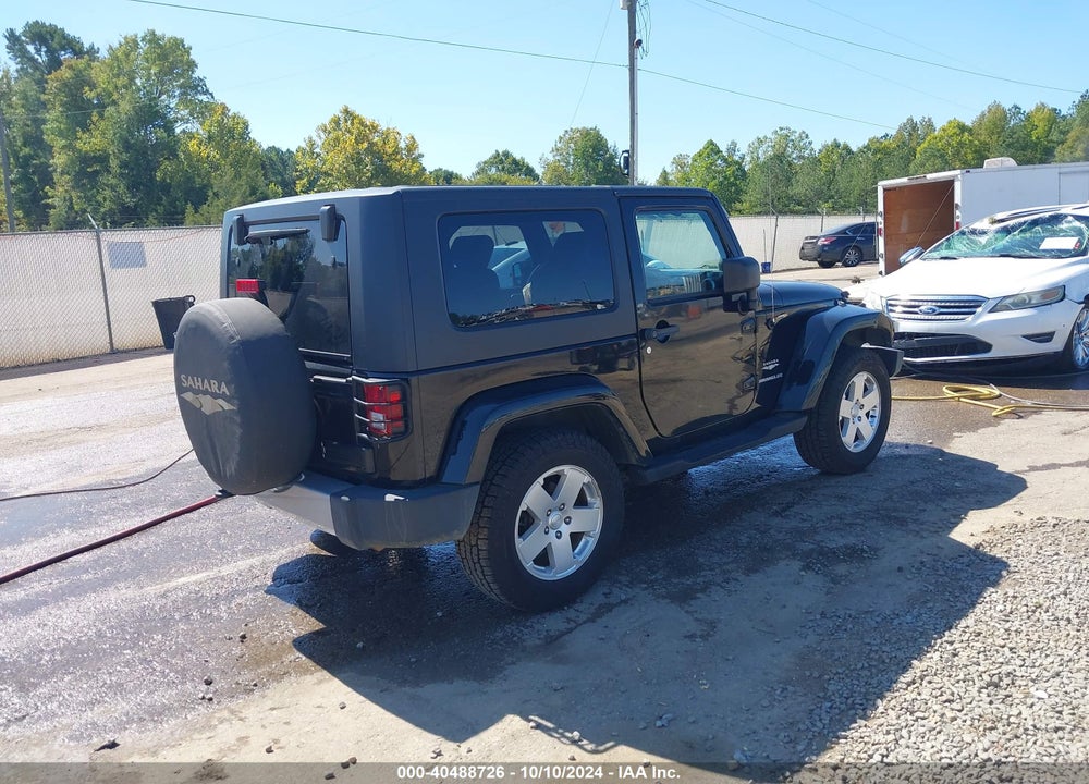 2010 JEEP WRANGLER SAHARA VIN: 1J4GA5D1XAL216217