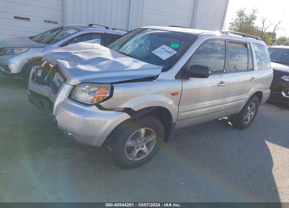 2007 HONDA PILOT EX-L VIN: 5FNYF18597B011694