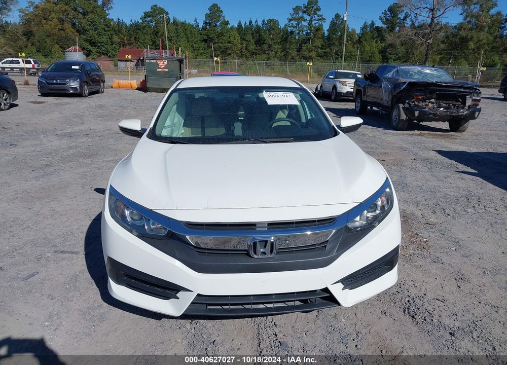 2018 HONDA CIVIC LX VIN: 19XFC2F51JE026406