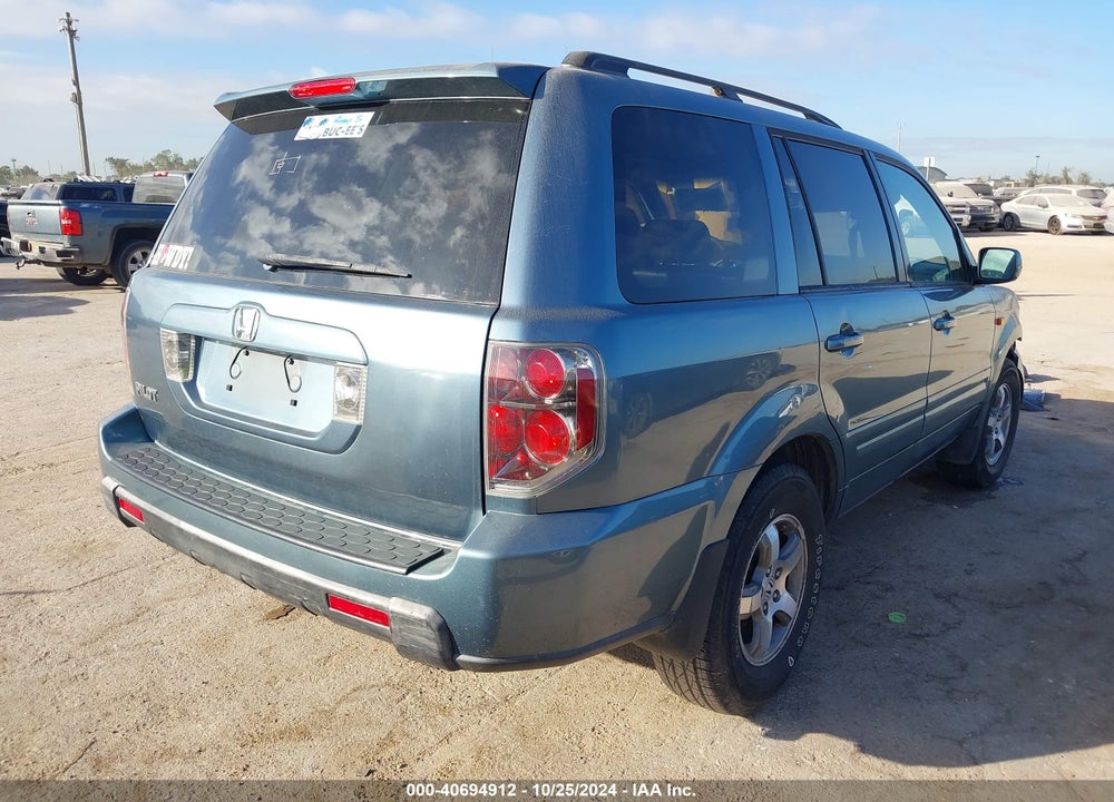 2006 HONDA PILOT EX-L VIN: 5FNYF28596B052394
