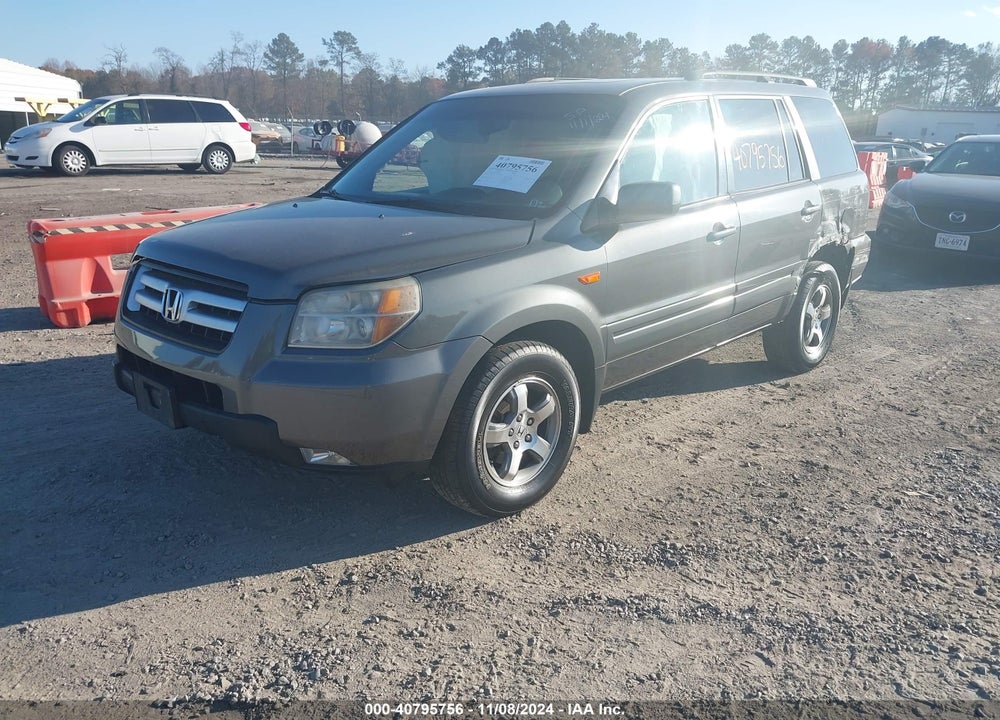 2007 HONDA PILOT EX-L VIN: 2HKYF18557H510042