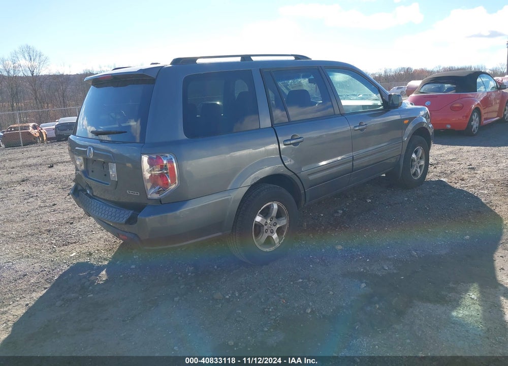 2007 HONDA PILOT EX-L VIN: 5FNYF18697B013499