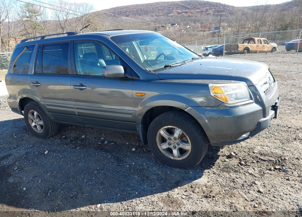 2007 HONDA PILOT EX-L VIN: 5FNYF18697B013499