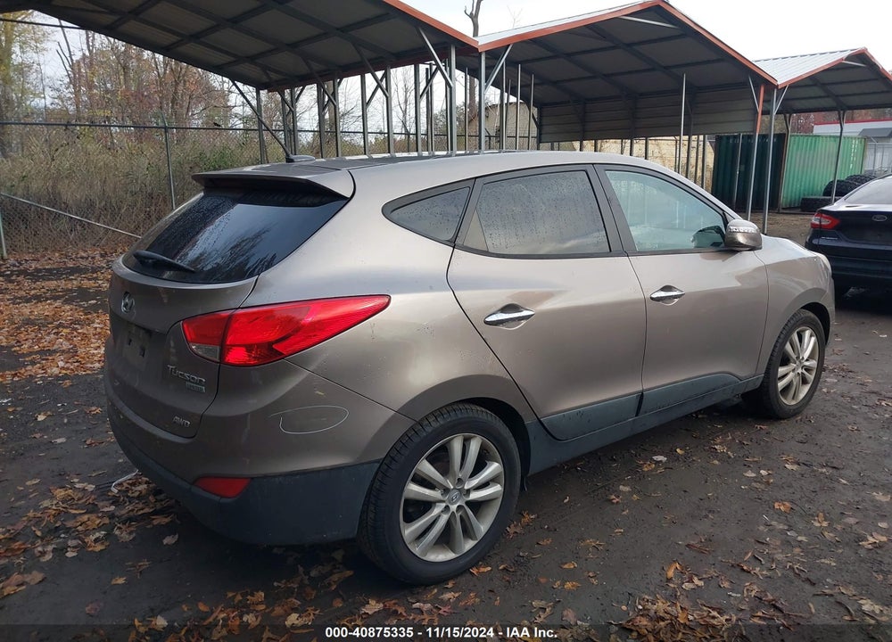 2011 HYUNDAI TUCSON VIN: KM8JUCAC0BU312698