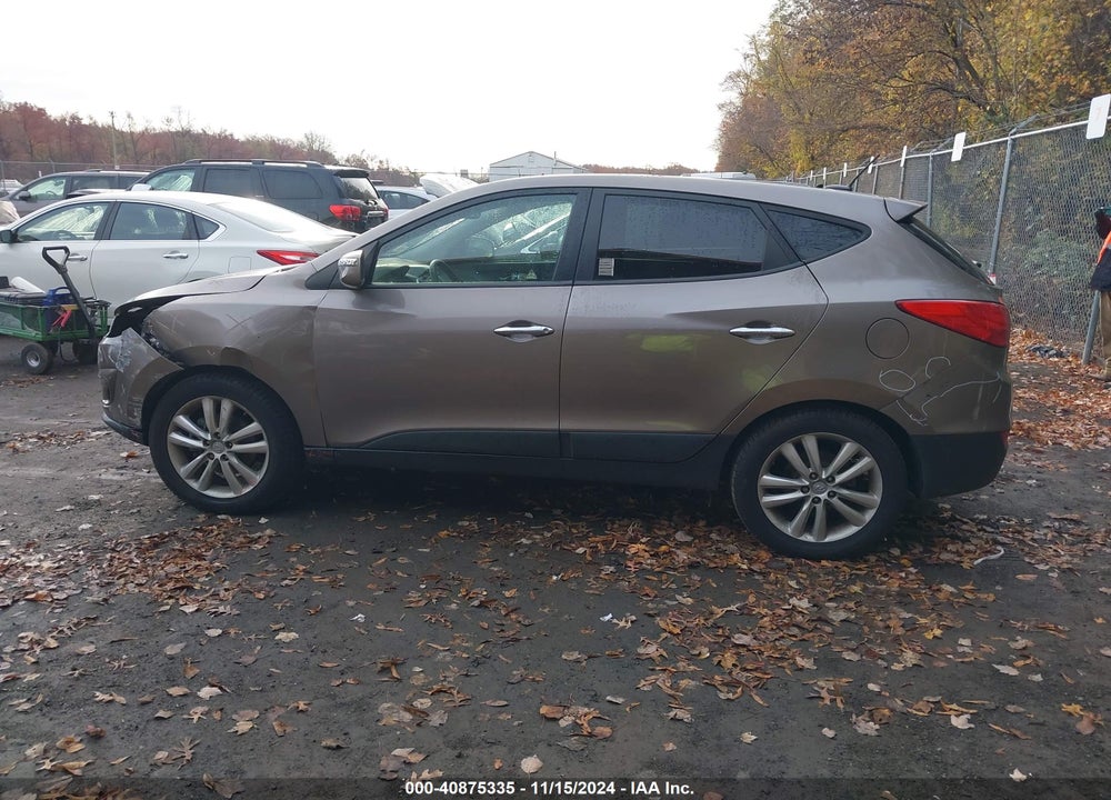 2011 HYUNDAI TUCSON VIN: KM8JUCAC0BU312698