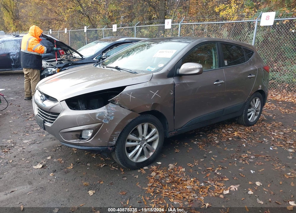 2011 HYUNDAI TUCSON VIN: KM8JUCAC0BU312698
