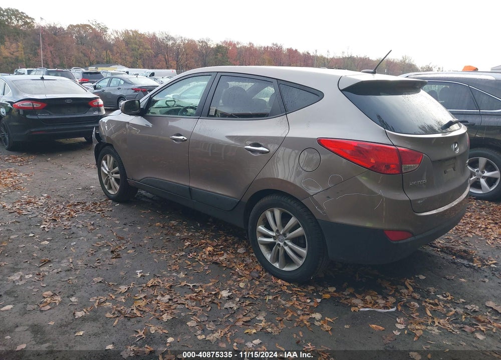 2011 HYUNDAI TUCSON VIN: KM8JUCAC0BU312698