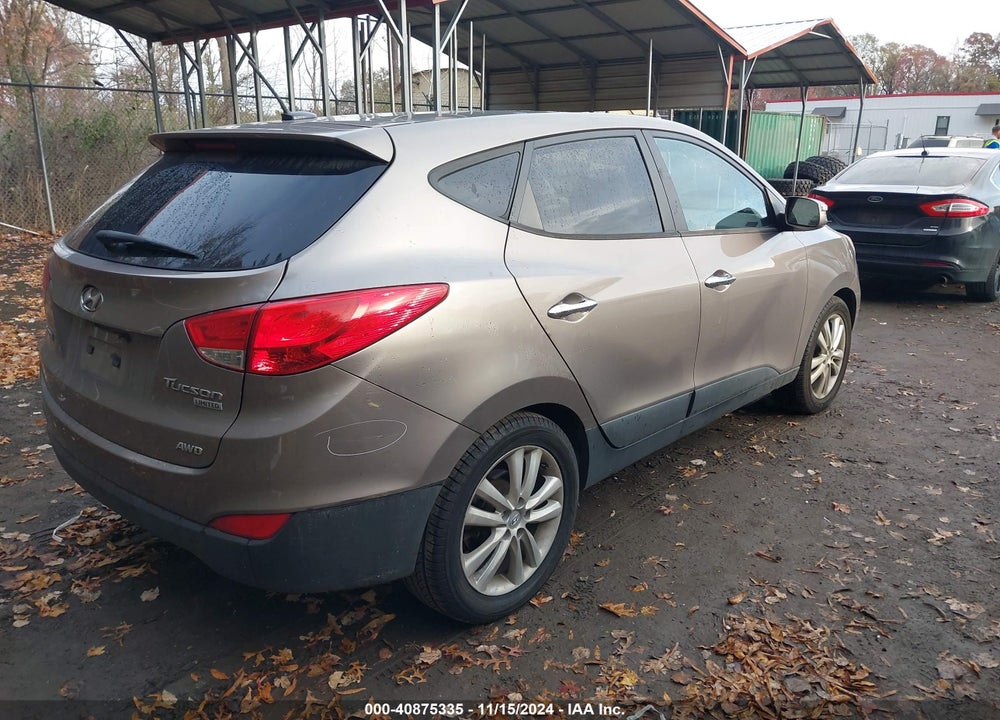 2011 HYUNDAI TUCSON VIN: KM8JUCAC0BU312698