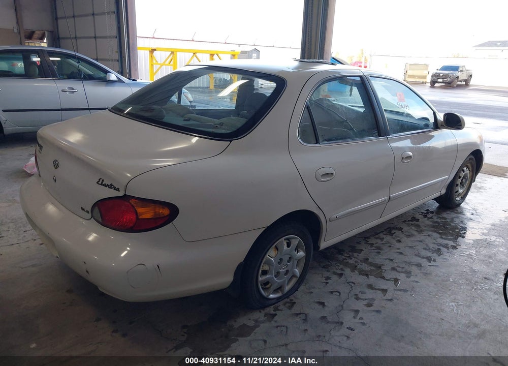 2000 HYUNDAI ELANTRA GLS VIN: KMHJF35F7YU054638