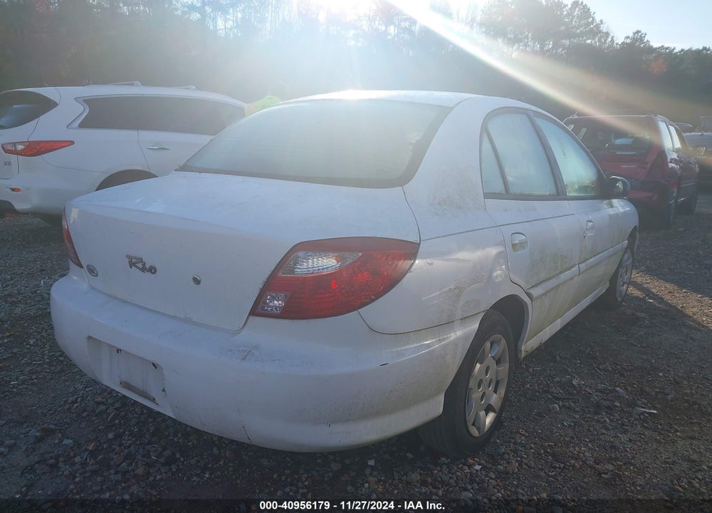 2002 KIA RIO VIN: KNADC123026201318
