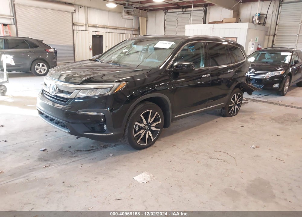 2022 HONDA PILOT 2WD TOURING 7 PASSENGER VIN: 5FNYF5H60NB013377