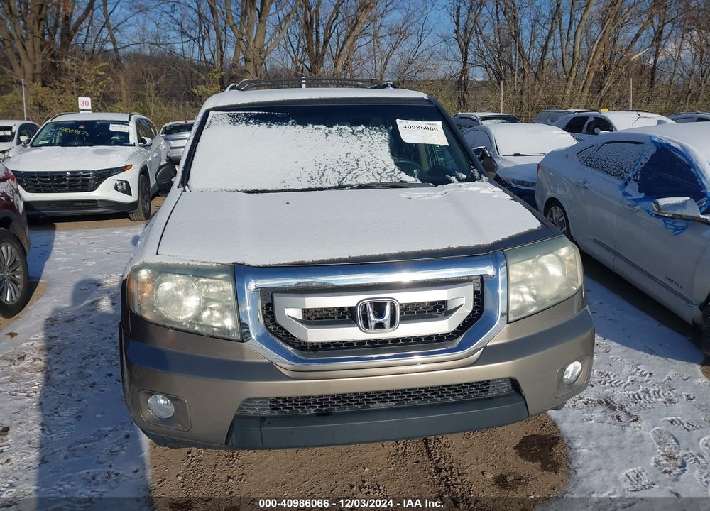 2011 HONDA PILOT EX-L VIN: 5FNYF4H57BB050990