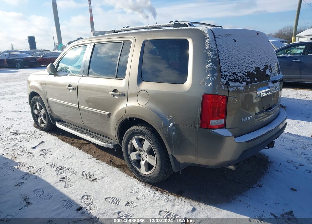 2011 HONDA PILOT EX-L VIN: 5FNYF4H57BB050990