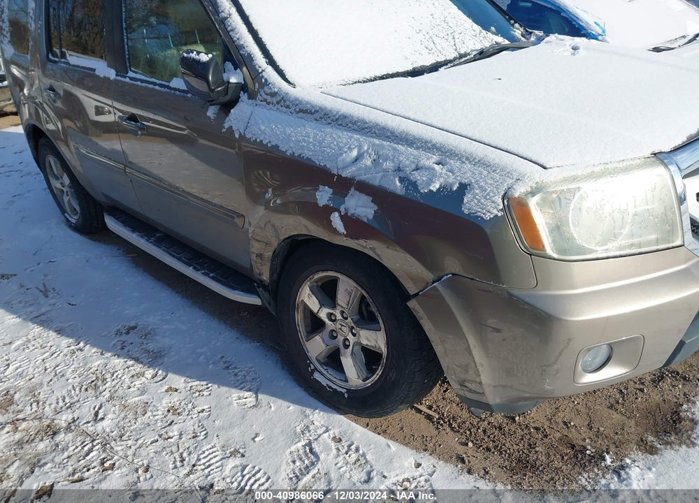 2011 HONDA PILOT EX-L VIN: 5FNYF4H57BB050990