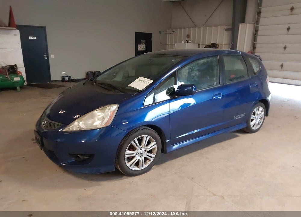2009 HONDA FIT VIN: JHMGE884X9C000393