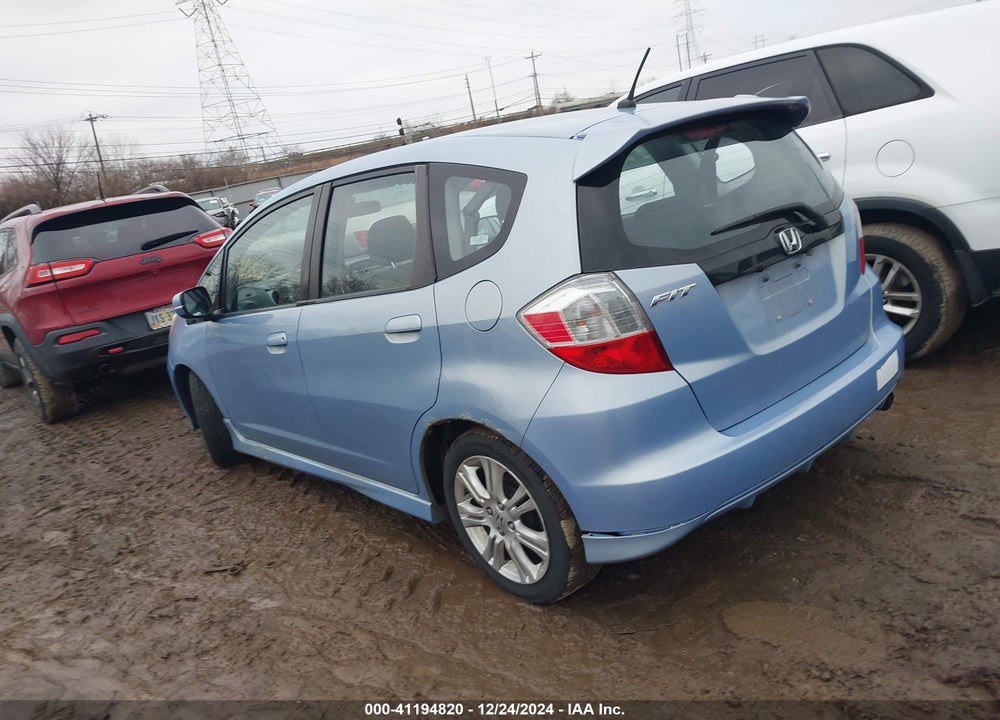 2009 HONDA FIT VIN: JHMGE88489S034127