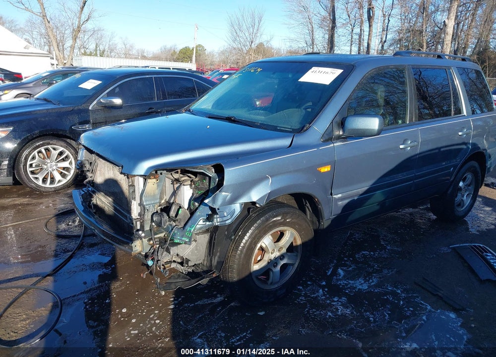 2007 HONDA PILOT EX-L VIN: 5FNYF28677B028623