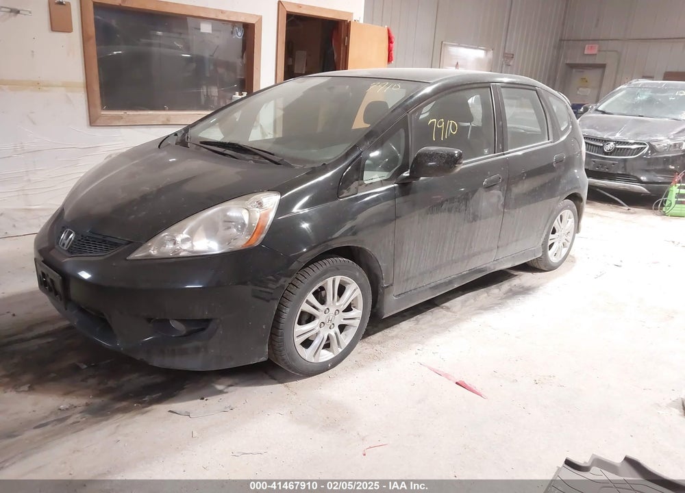 2009 HONDA FIT VIN: JHMGE874X9C002923