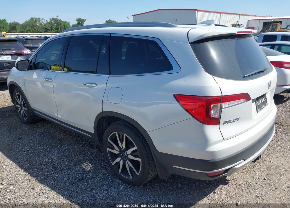 2021 HONDA PILOT 2WD TOURING 8 PASSENGER VIN: 5FNYF5H95MB001847