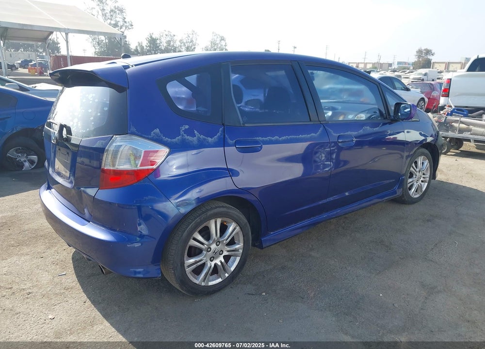 2009 HONDA FIT VIN: JHMGE884X9S044772