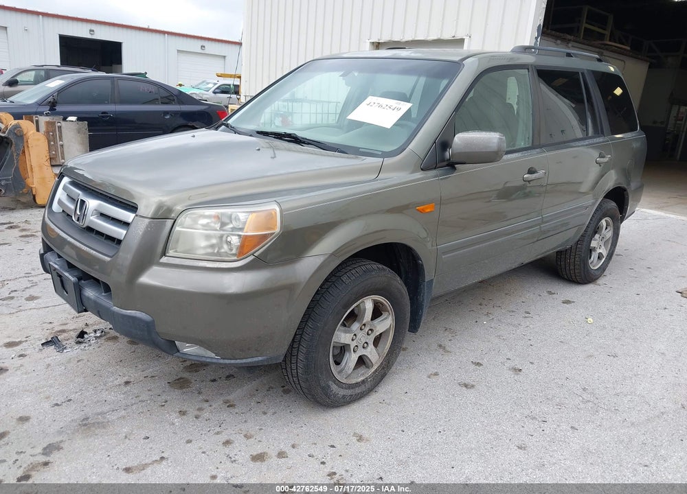 2007 HONDA PILOT EX-L VIN: 5FNYF18597B008424