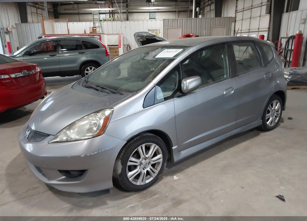 2009 HONDA FIT VIN: JHMGE88409S010324