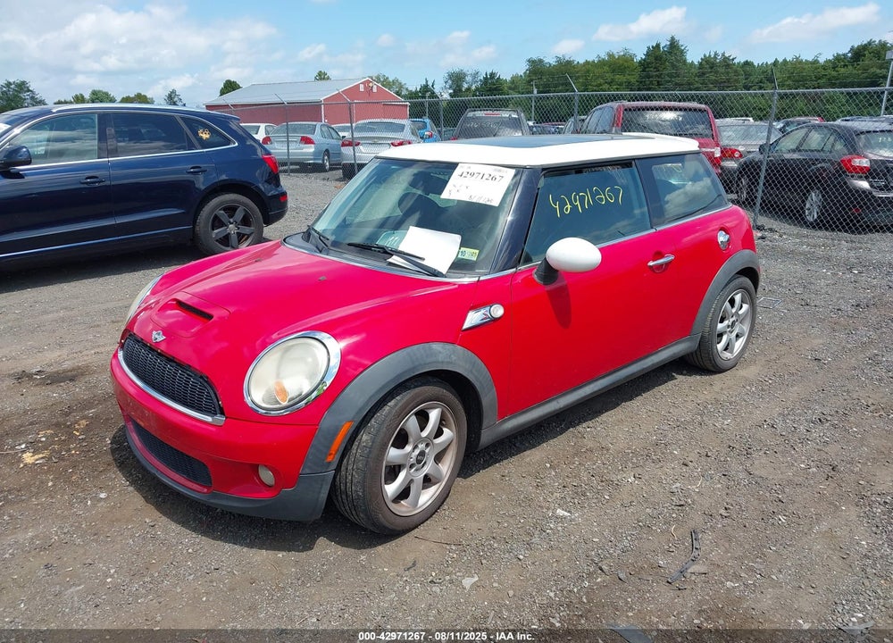 2009 MINI COOPER VIN: WMWMF73569TX40628