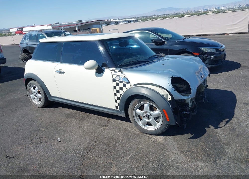 2009 MINI COOPER S VIN: WMWMF73599TW87858