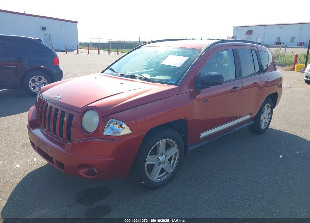 2010 JEEP COMPASS VIN: 1J4NF1FB0AD620094