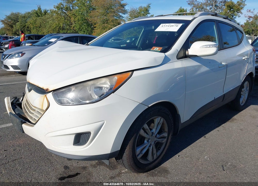 2012 HYUNDAI TUCSON VIN: KM8JUCAC1CU336154