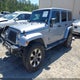 1C4HJWEG5EL143315 2014 Jeep Wrangler Unlimited Sahara auction photo thumbnail 2